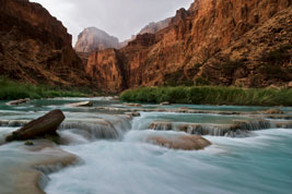 Travertines in the blue water of the Little Colorado River, at the bottom of the Little Colorado Gorge at Salt Canyon