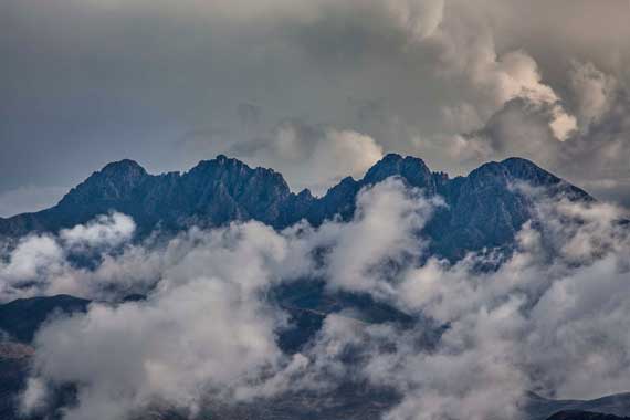 Clouds drift past Four Peaks in the Mazatzal Mts., Arizona