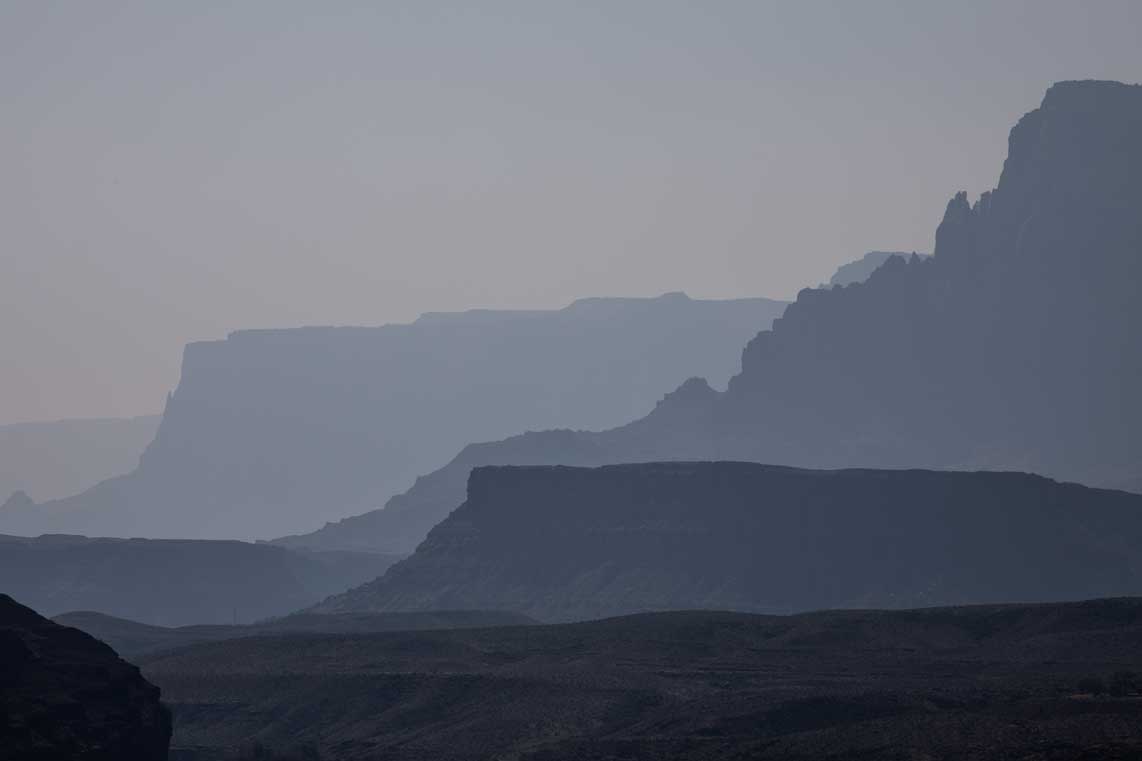 The Vermillion Cliffs as seen from Lee's Ferry, heavily backlit on a hazy day