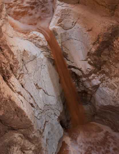 Muddy water in Salt Trail Canyon, a tributary of the Little Colorado River on the Navajo Nation in northern Arizona