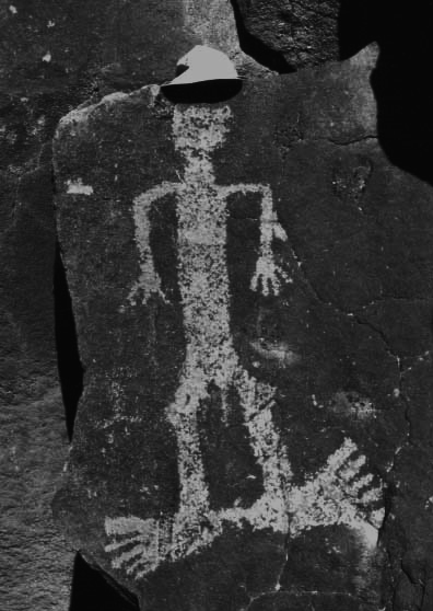 A Native American petroglyph on Perry Mesa. The ball cap was
added for size reference, as this ancient artwork is several feet tall.
