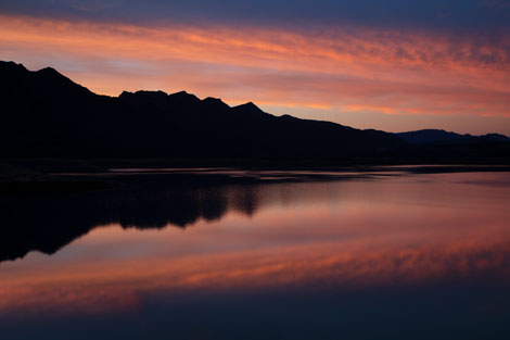 Refluctions of the sunset sky in Horseshoe Lake on the Verde River in the Arizona desert