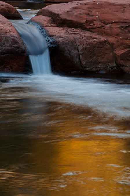 Rocks, water and gold reflections at Wet Beaver Creek, Arizona